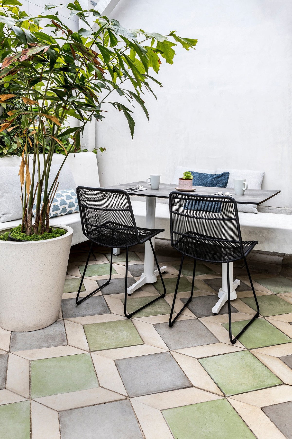 Corner table on green and gray tile
