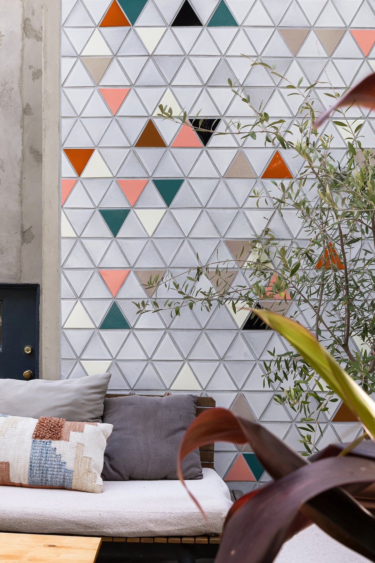 Colored triangles scattered on white