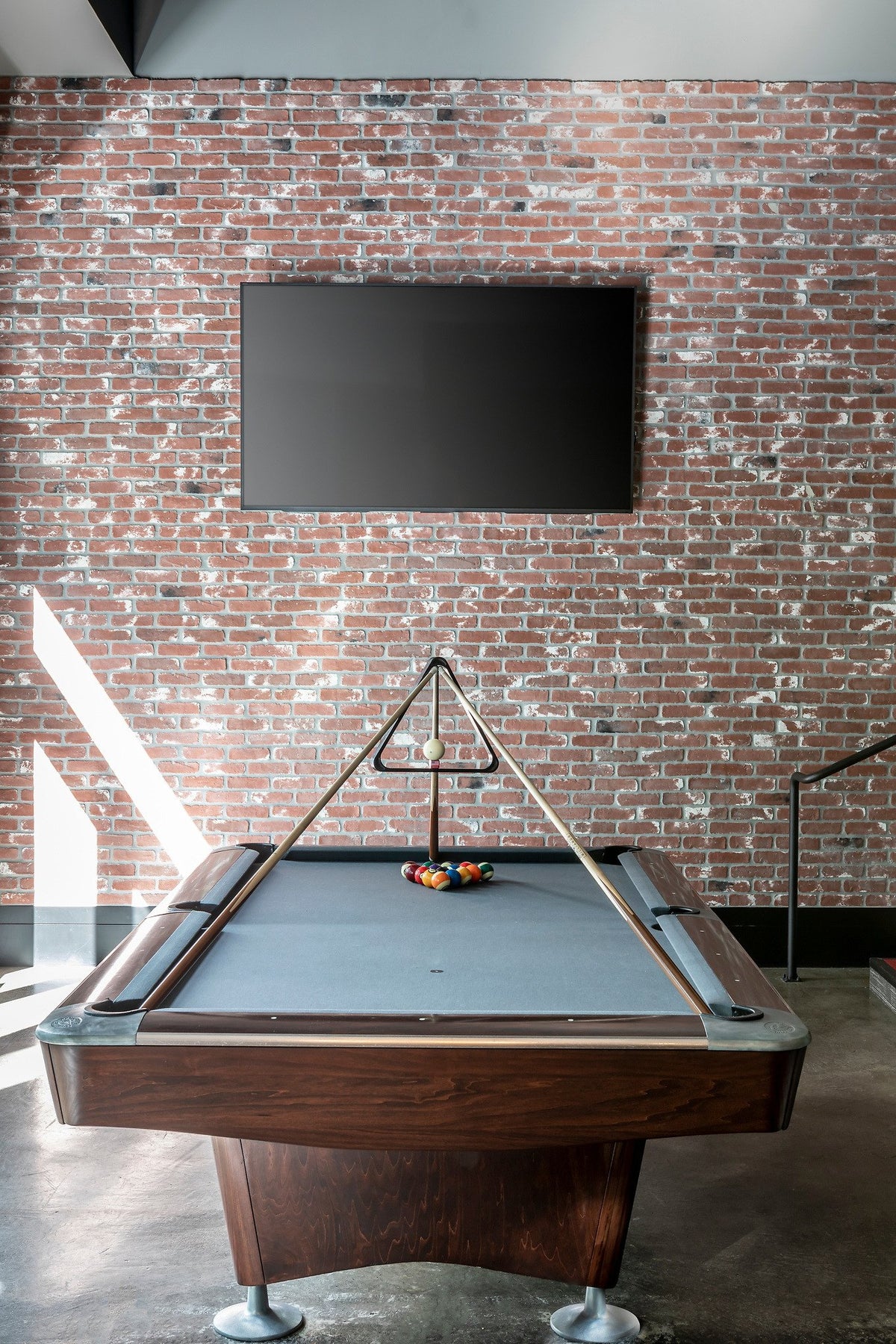 Billiards corner with brick wall