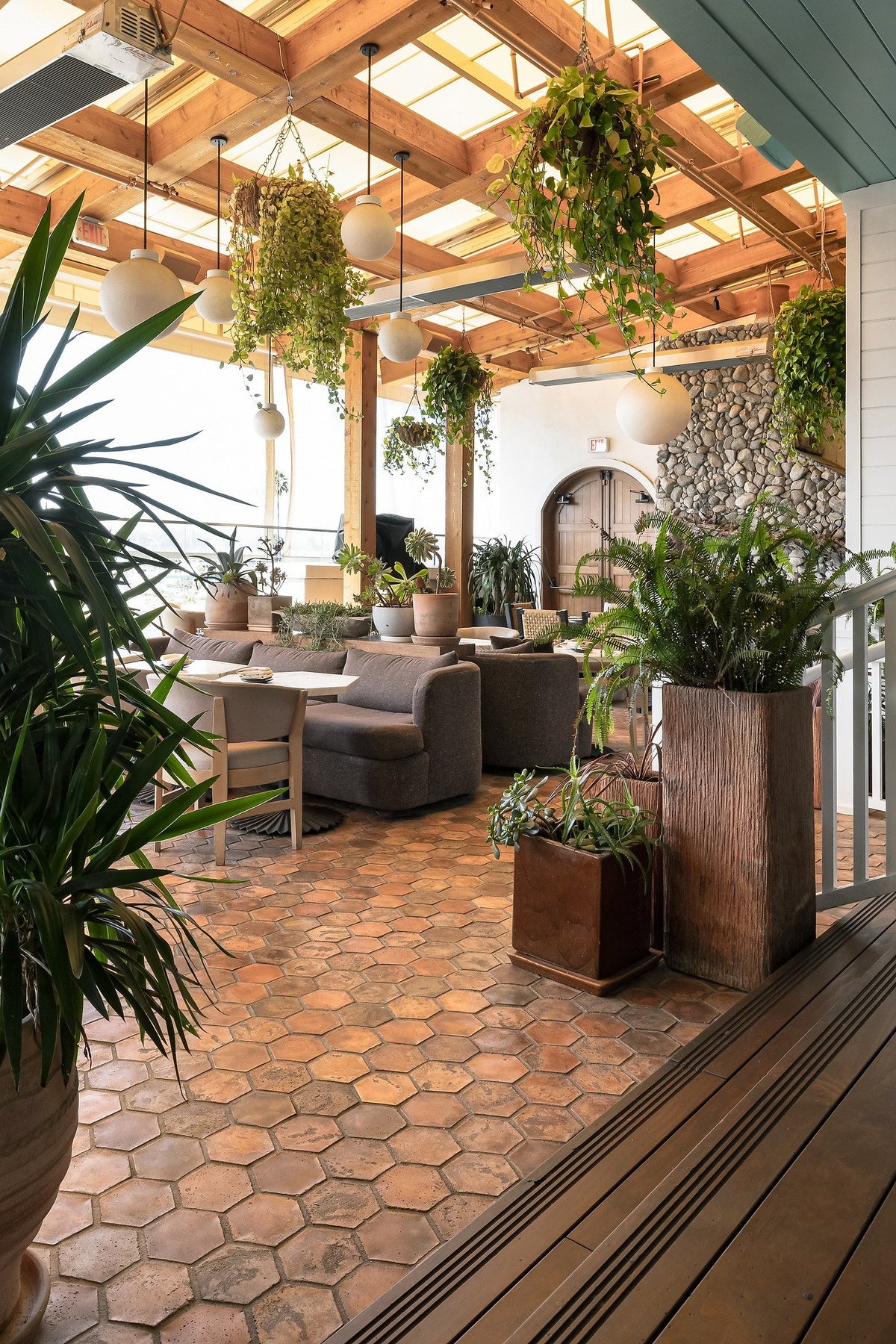 Lounge seating among potted plants