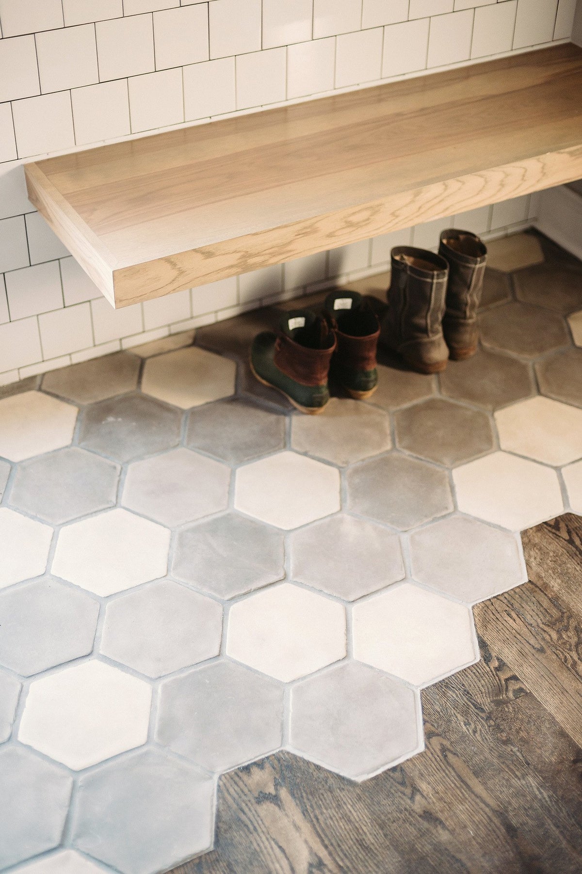 Mudroom bench over hexagon tile