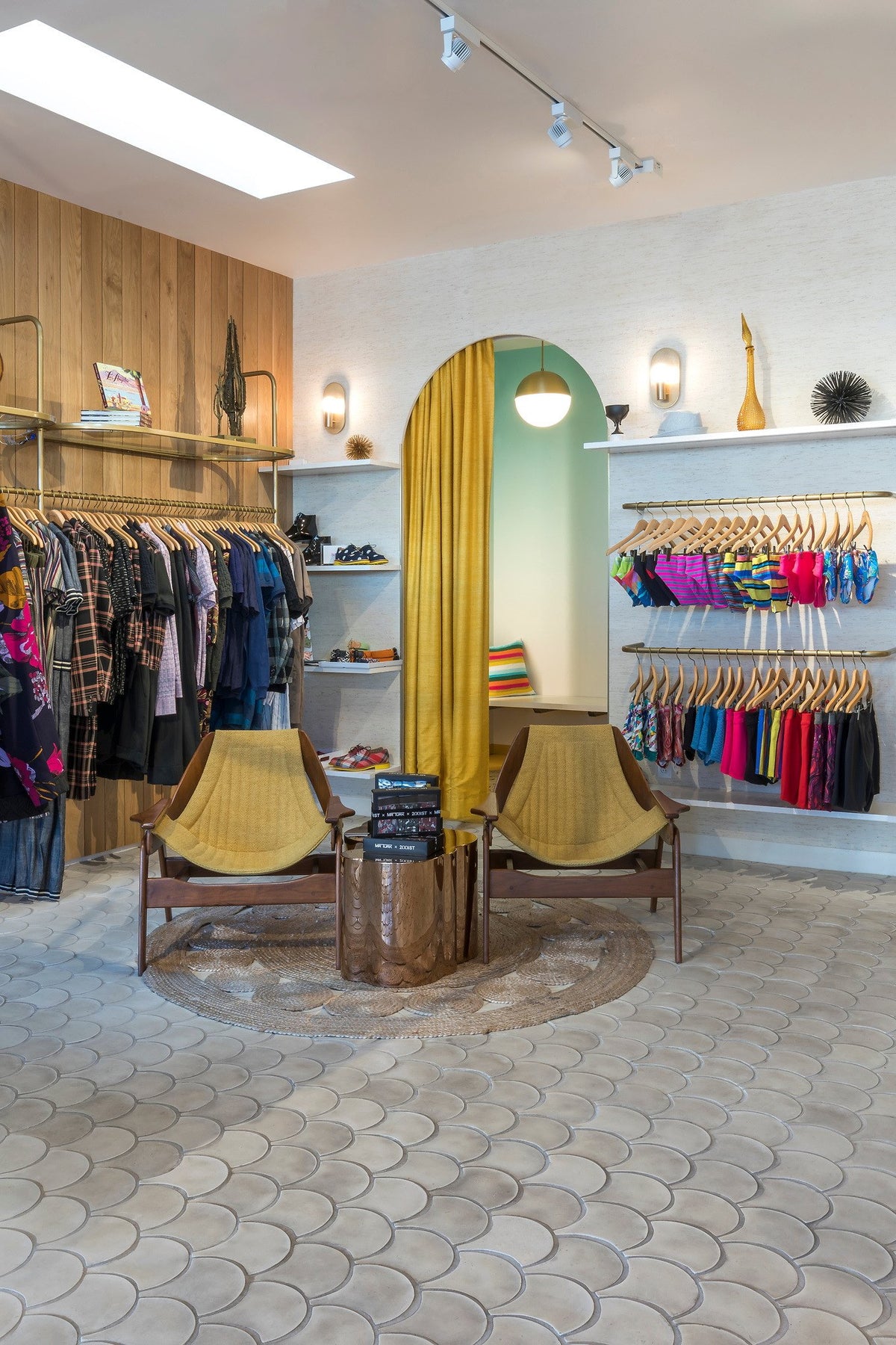 Arched fitting room and lounge chairs