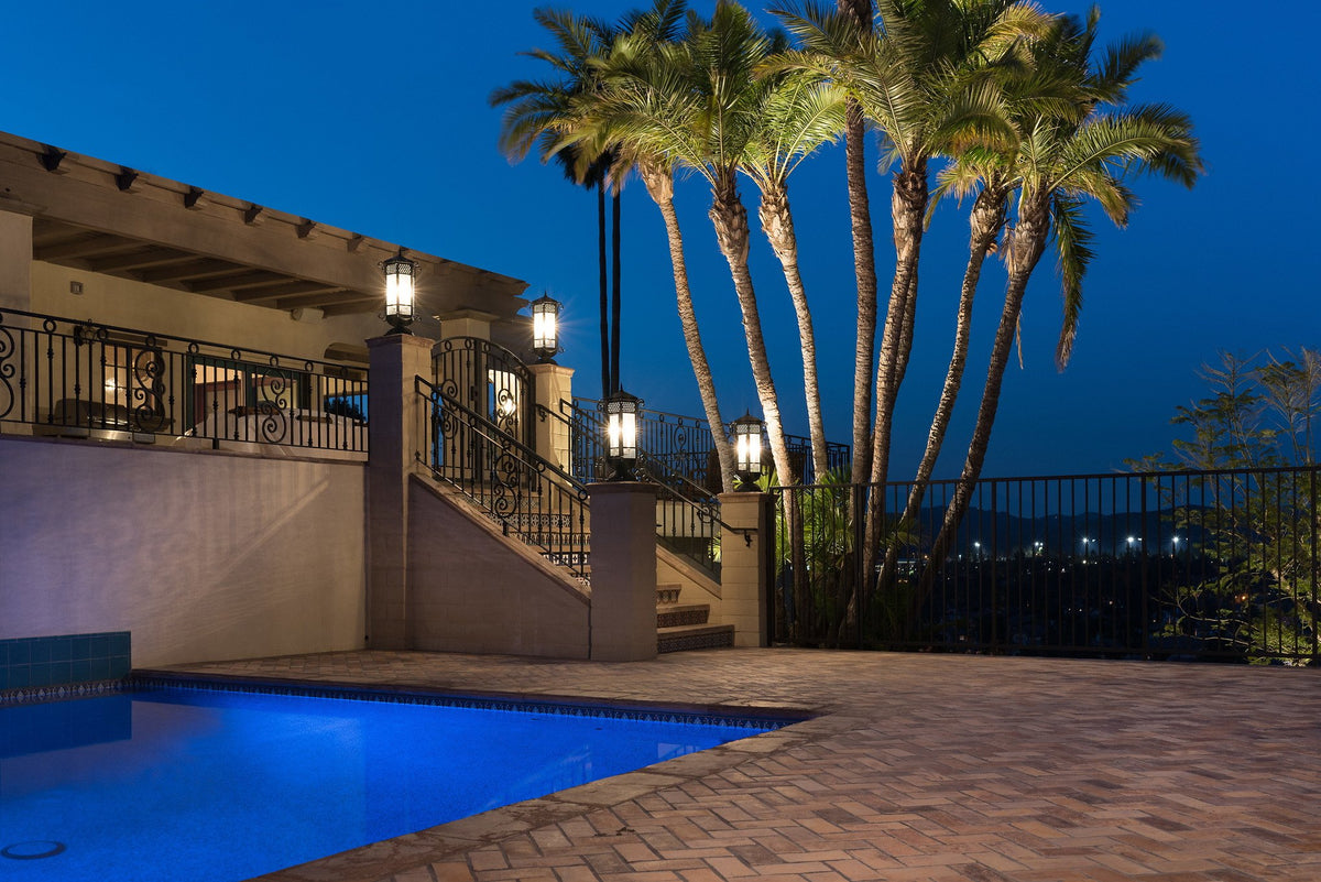 Herringbone brick pool deck at dusk