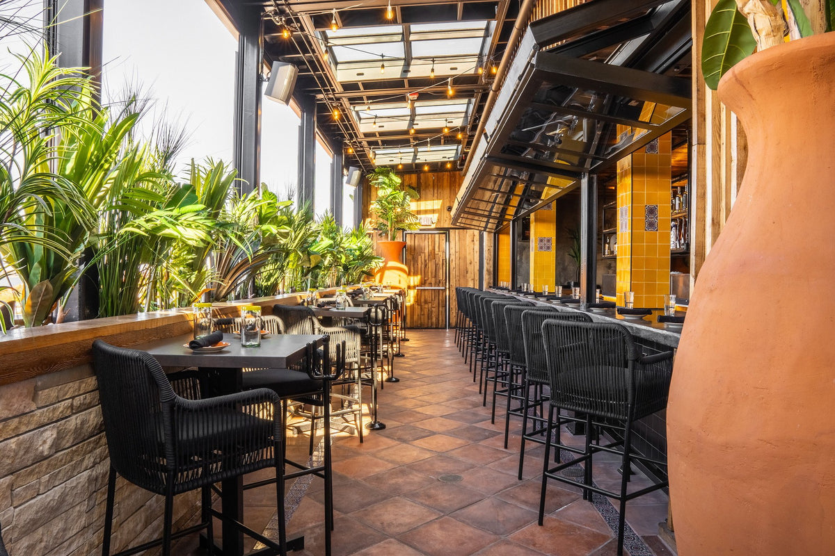 Bar stools and planters on cotto