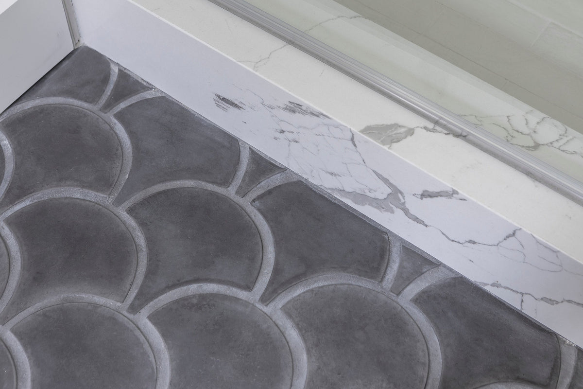Charcoal Conche along the vanity edge