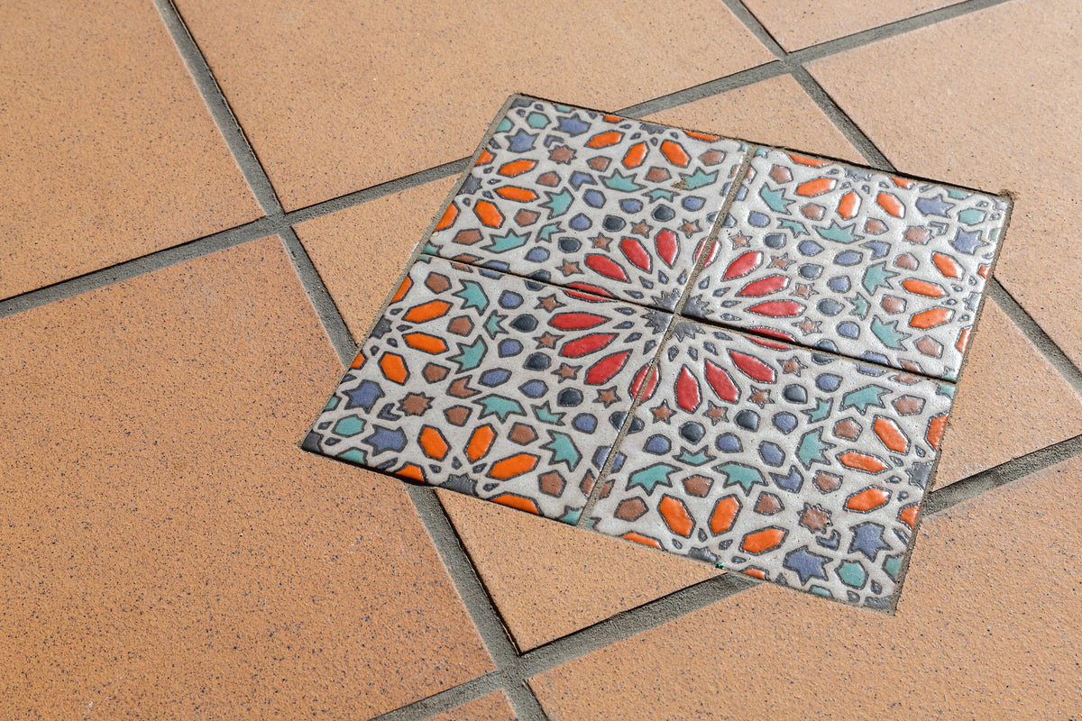 Hand-painted deco inset in porch floor