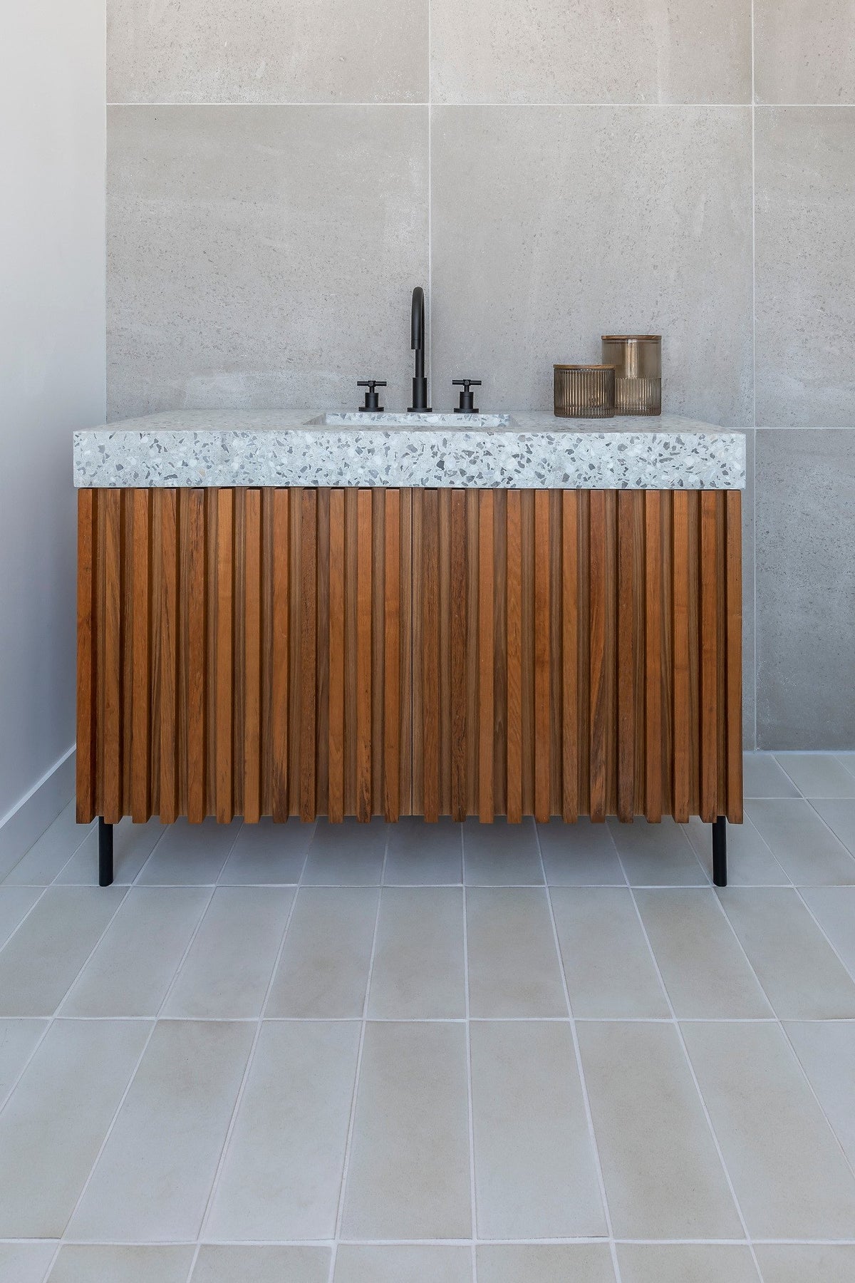 Wood vanity on Sierra Snow tile