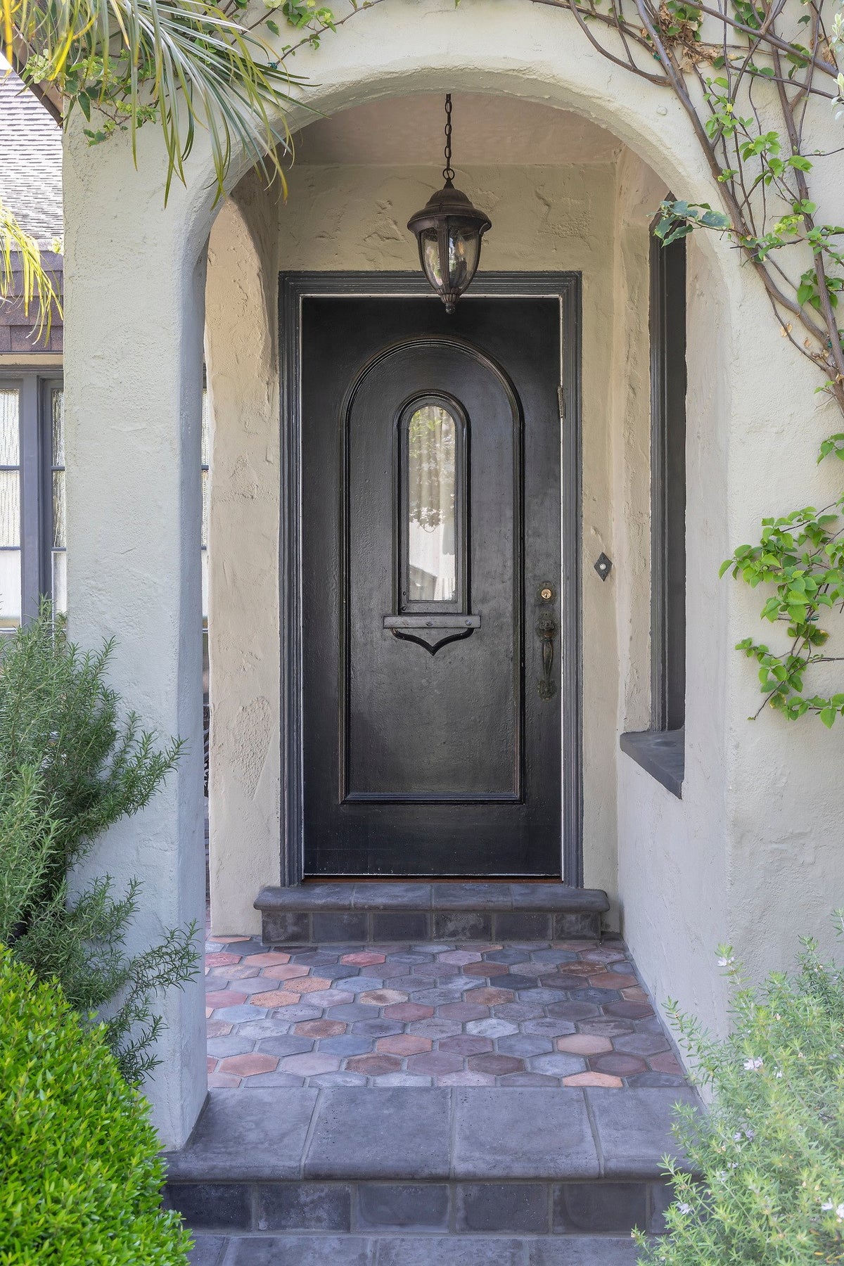 Arched entry with tile landing