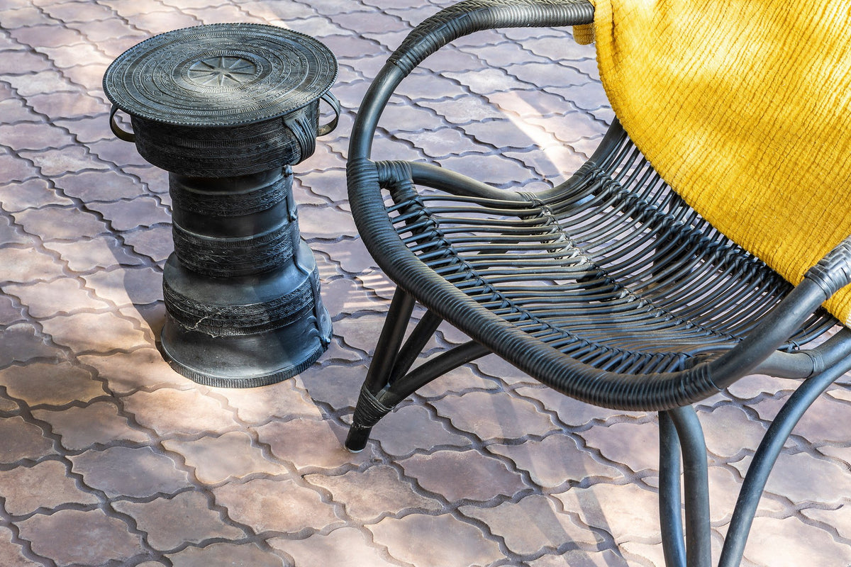 Arabesque tile beside rattan chair