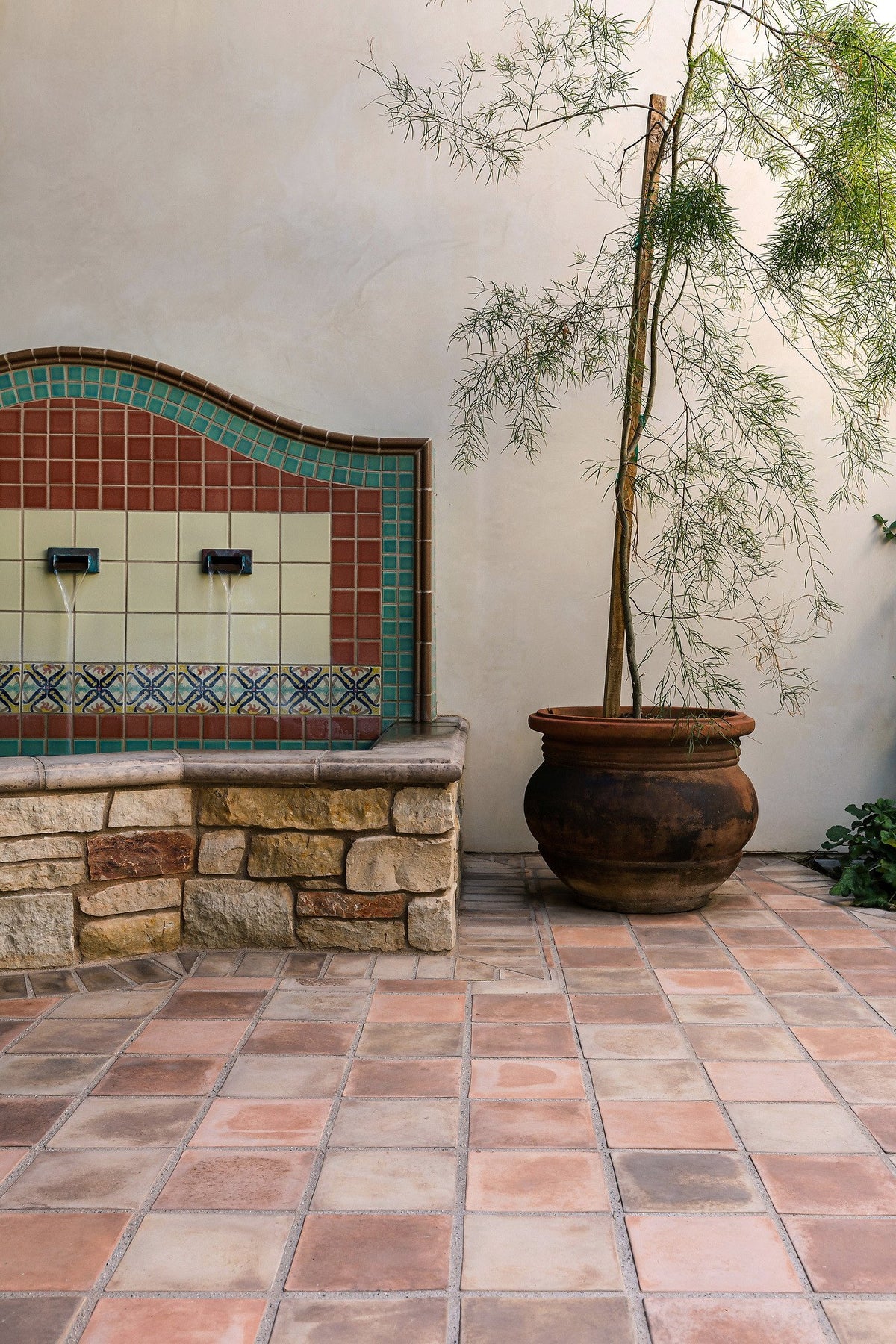 Courtyard fountain wall and planter